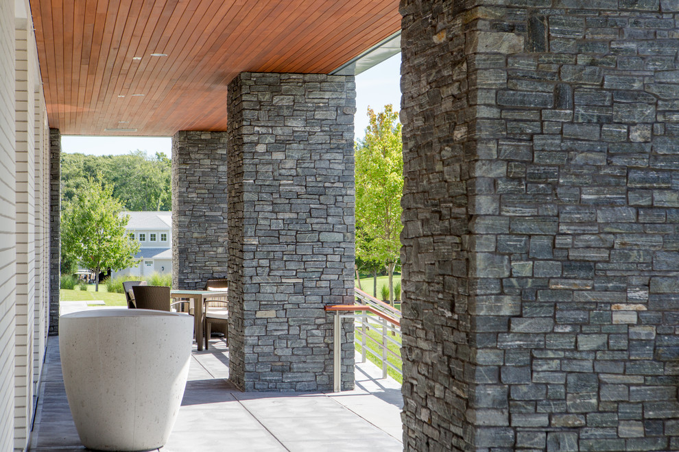 Photo of a contemporary exterior in Boston with stone veneer.
