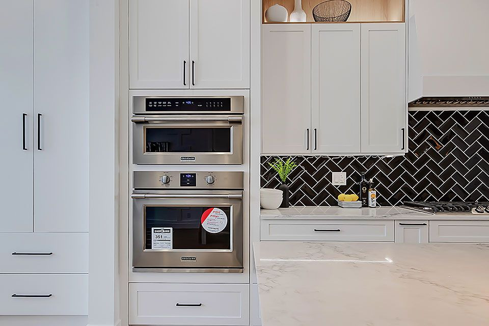 Example of a transitional home design design in Calgary