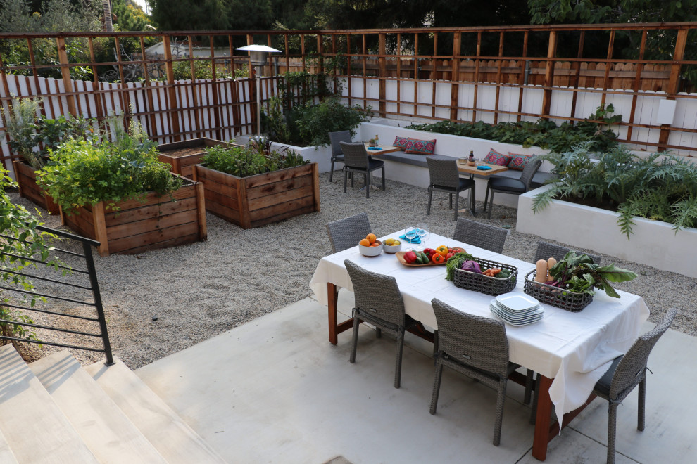 Example of a large backyard gravel patio vegetable garden design in Los Angeles