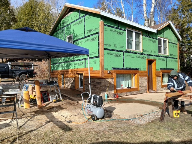 Log Siding, Stamped Concrete and Post and Beam Carport