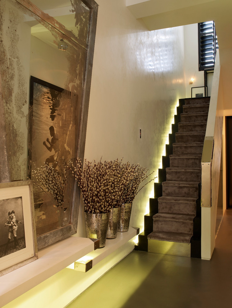 This is an example of a contemporary foyer in London with white walls.