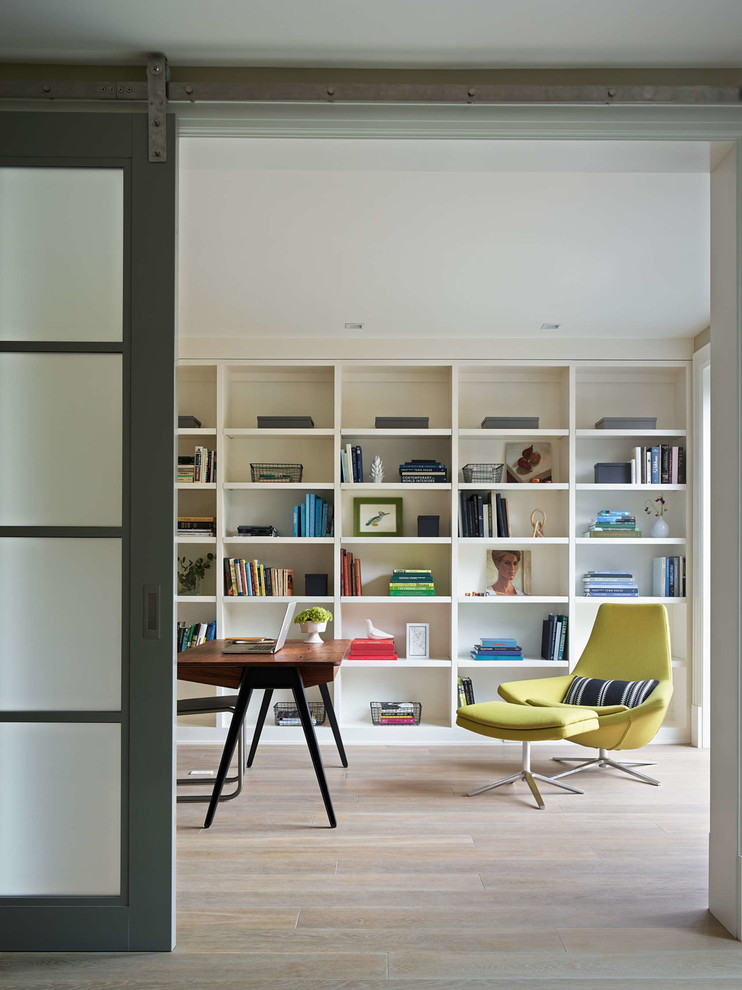 Inspiration for a transitional study room in San Francisco with light hardwood floors and a freestanding desk.