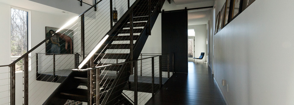 Modern metal staircase in Raleigh with metal risers.
