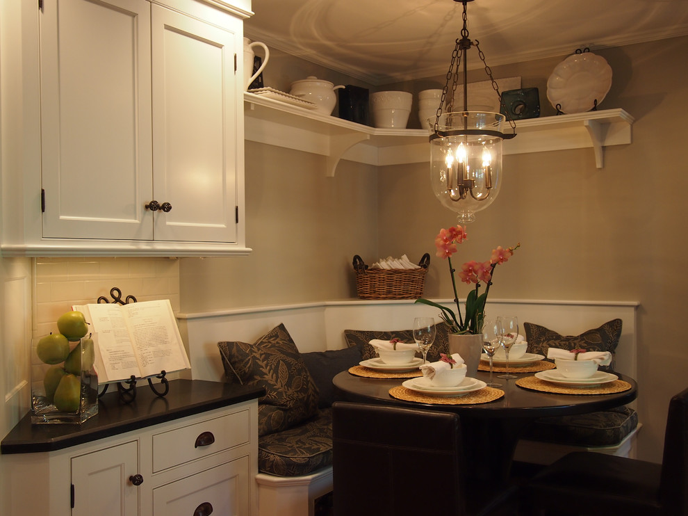 Inspiration for a transitional eat-in kitchen remodel in Boston with recessed-panel cabinets, white cabinets, granite countertops, white backsplash, subway tile backsplash and stainless steel appliances