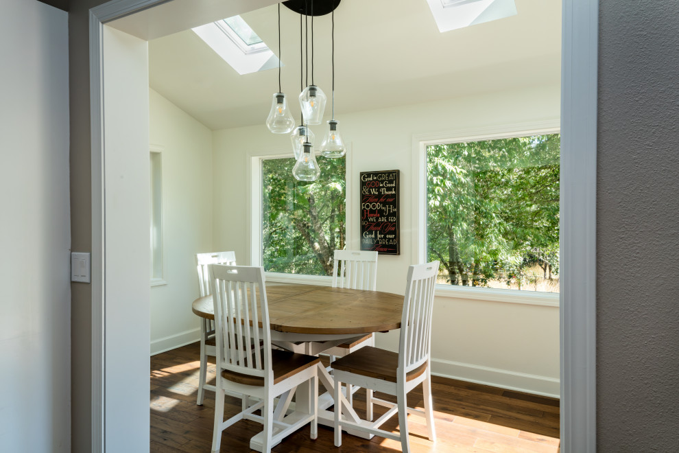Breakfast nook - mid-sized rustic medium tone wood floor and brown floor breakfast nook idea with white walls and no fireplace