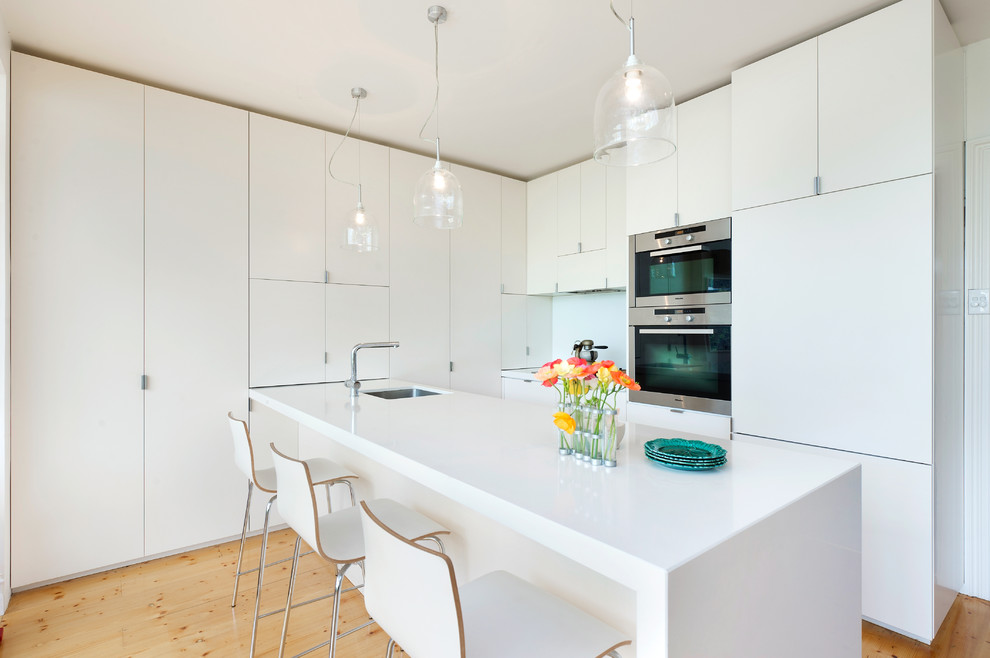 This is an example of a contemporary kitchen in Melbourne with panelled appliances.