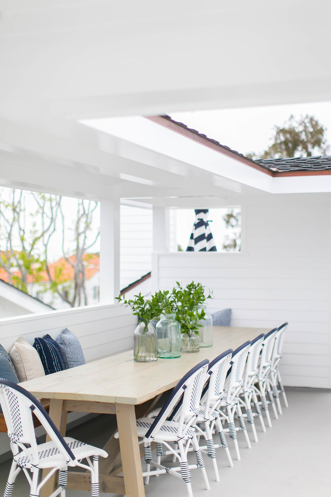 Inspiration for a large country rooftop deck in Orange County with an outdoor kitchen and a roof extension.