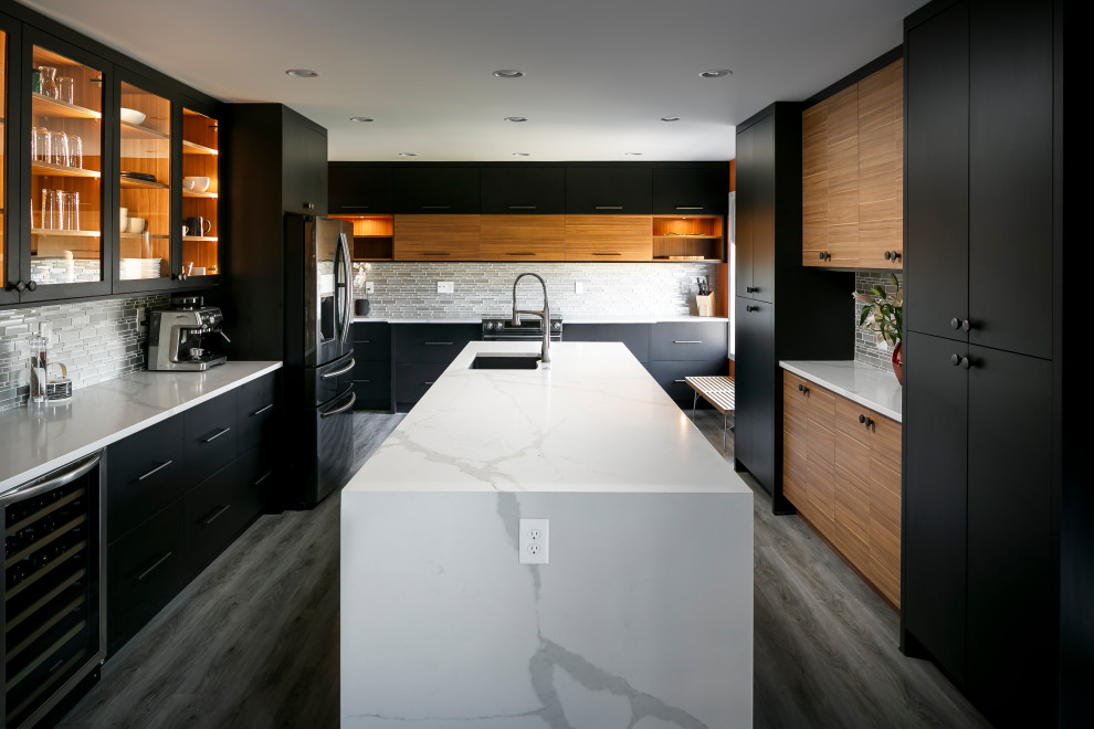 Large contemporary u-shaped eat-in kitchen in Louisville with black cabinets and quartz benchtops.