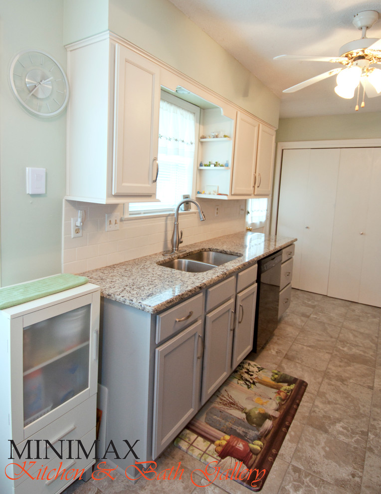 Example of a small transitional galley porcelain tile enclosed kitchen design with an undermount sink, shaker cabinets, gray cabinets, granite countertops, white backsplash, subway tile backsplash and black appliances
