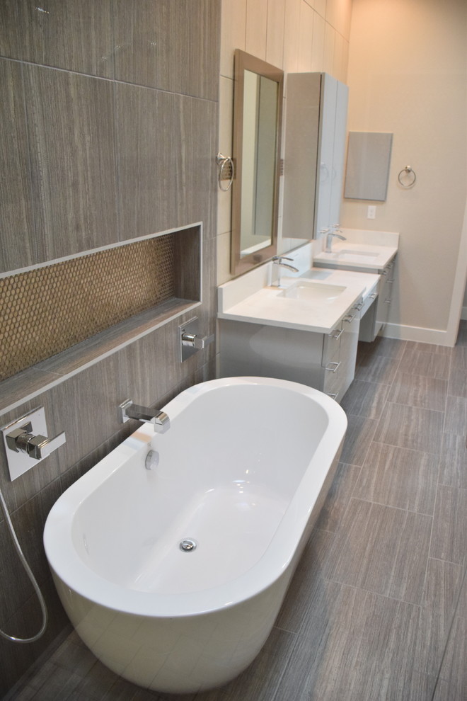 Home design - large transitional gray tile and ceramic tile ceramic tile home design idea in Austin with flat-panel cabinets, white cabinets, gray walls, a drop-in sink and quartzite countertops