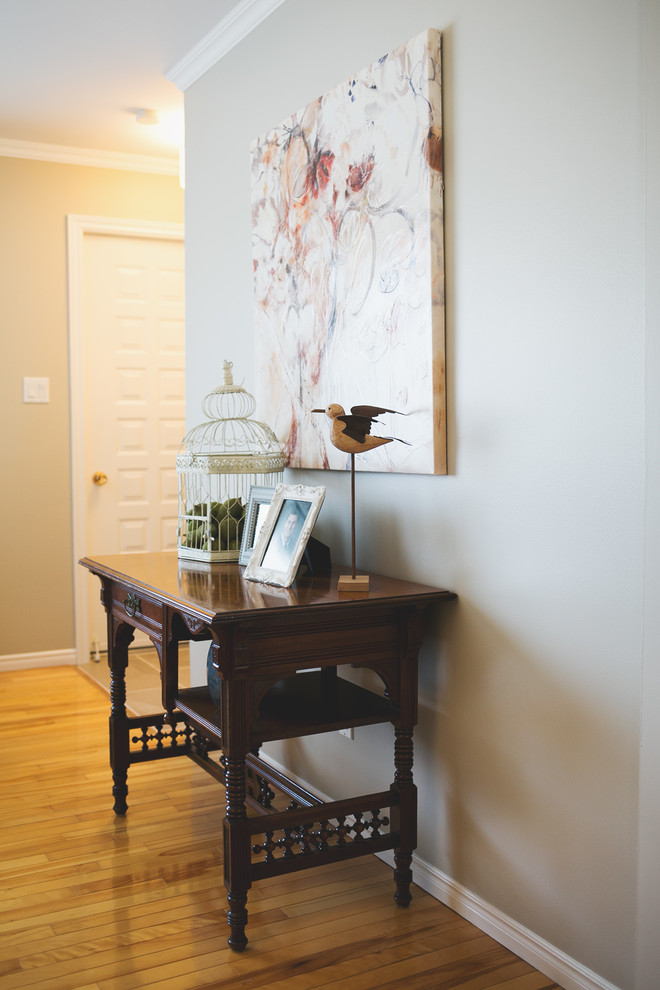 Home design - mid-sized transitional formal and enclosed light wood floor home design idea with beige walls, a corner fireplace, a tile fireplace and no tv
