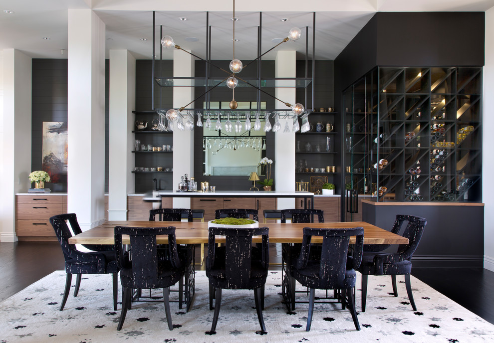 This is an example of a contemporary dining room in Denver with black walls, dark hardwood floors and black floor.