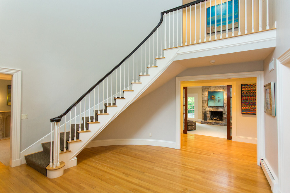 Contemporary carpeted curved staircase in Boston.