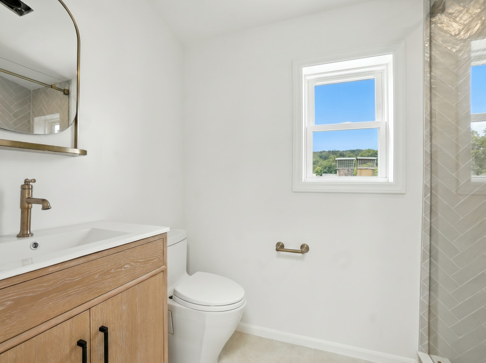 Bathroom with Brass Faucet and Arched Mirror