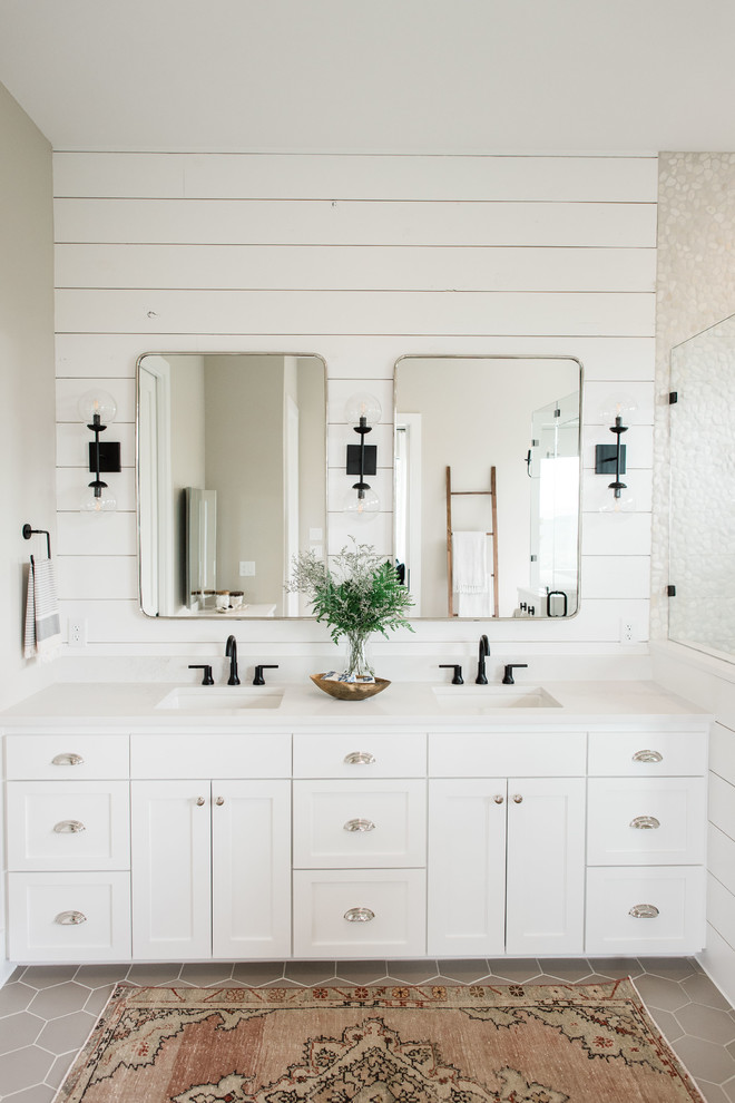 Photo of a large country master bathroom in Austin with shaker cabinets, white cabinets, a freestanding tub, a corner shower, white walls, porcelain floors, a drop-in sink, engineered quartz benchtops, grey floor, a hinged shower door and white benchtops.
