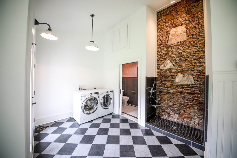 Photo of a large country l-shaped utility room in Other with multi-coloured floor and white walls.