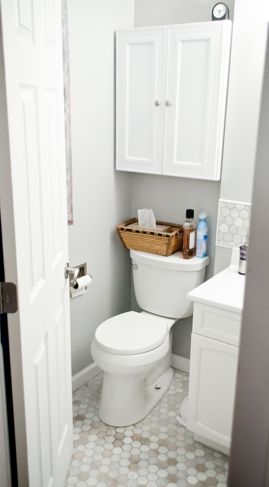 Small transitional master white tile and marble tile mosaic tile floor alcove shower photo in Chicago with shaker cabinets, white cabinets, a two-piece toilet, gray walls, an integrated sink and marble countertops