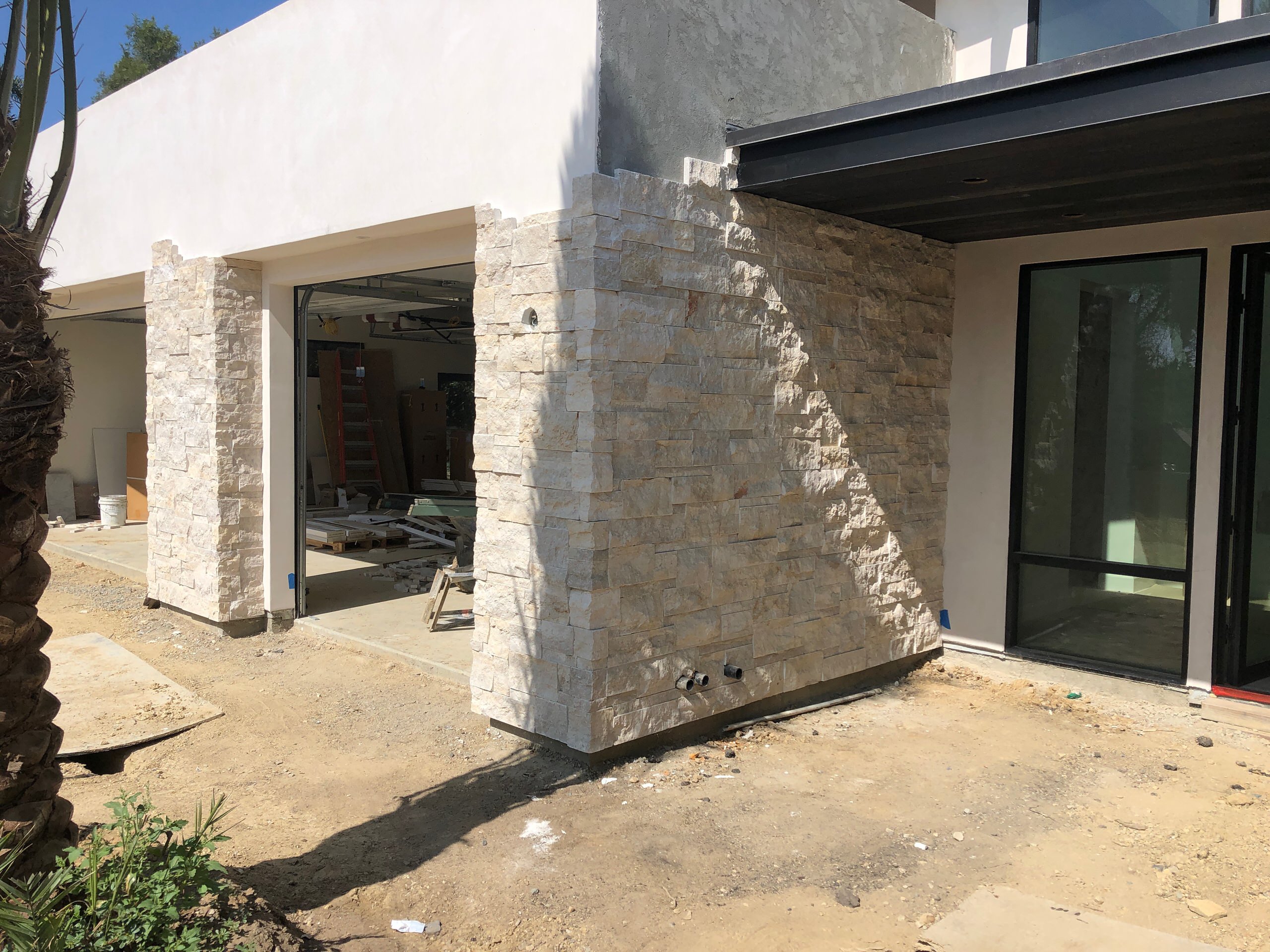 Installing Stone Veneer to a House & Garage Wall in La Jolla