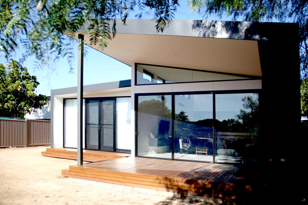 Photo of a mid-sized modern one-storey black exterior in Adelaide with metal siding.