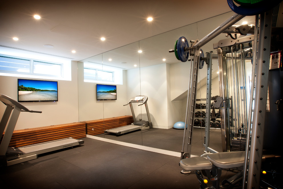 Design ideas for a contemporary home gym in Sydney with beige walls.