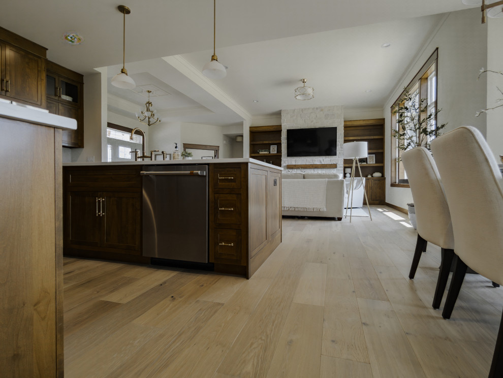 Transitional galley light wood floor and beige floor open concept kitchen photo with shaker cabinets, medium tone wood cabinets, ceramic backsplash and an island