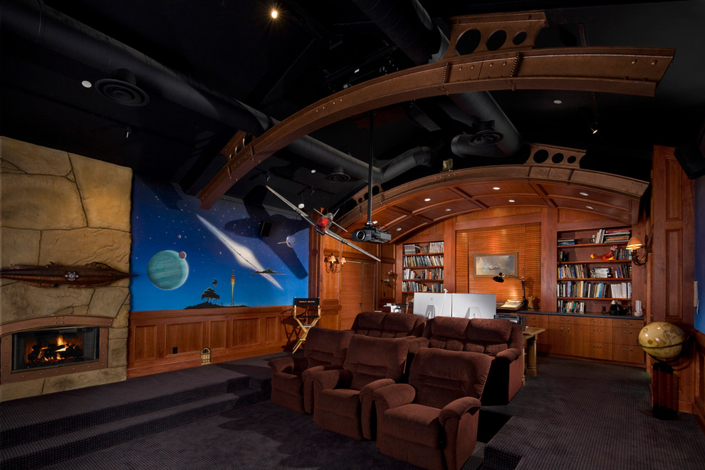 Enclosed home theatre in Santa Barbara with multi-coloured walls, carpet, a projector screen and black floor.