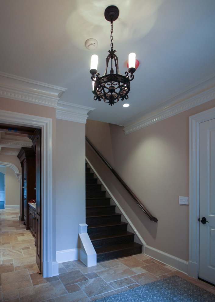 Photo of a mid-sized traditional wood curved staircase in DC Metro with wood risers and mixed railing.