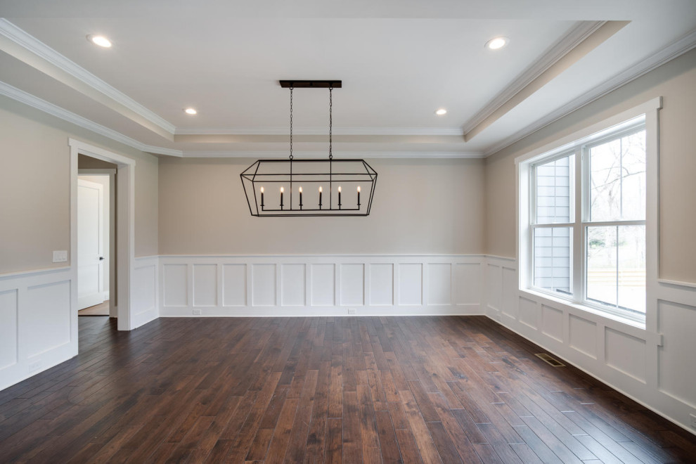 Inspiration for an arts and crafts separate dining room in DC Metro with beige walls, dark hardwood floors, recessed and decorative wall panelling.