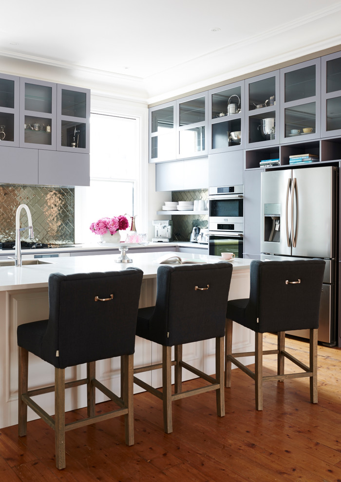 This is an example of a large transitional l-shaped eat-in kitchen in Melbourne with shaker cabinets, grey cabinets, granite benchtops and with island.