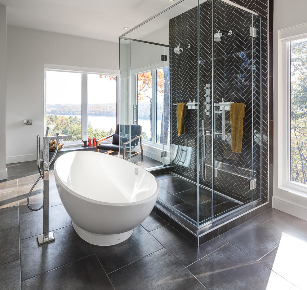 This is an example of a mid-sized contemporary master bathroom in Ottawa with a freestanding tub, a double shower, black tile, white walls and porcelain floors.