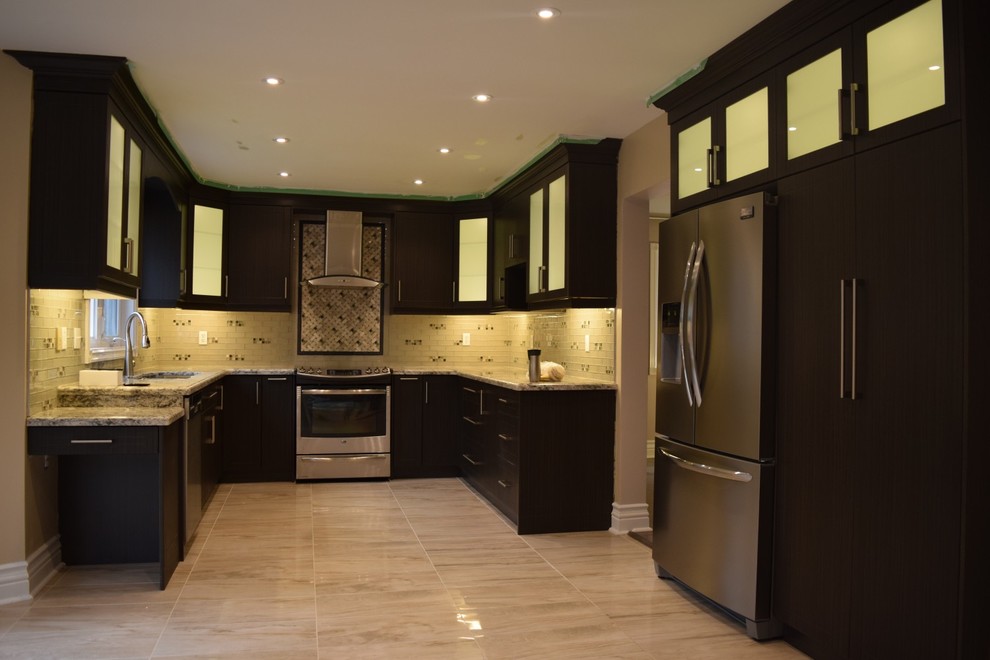 Inspiration for a large contemporary u-shaped kitchen in Toronto with an undermount sink, flat-panel cabinets, dark wood cabinets, granite benchtops, beige splashback, glass tile splashback, stainless steel appliances, marble floors and no island.