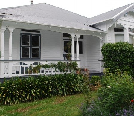 Inspiration for a traditional one-storey white exterior in Melbourne with wood siding.