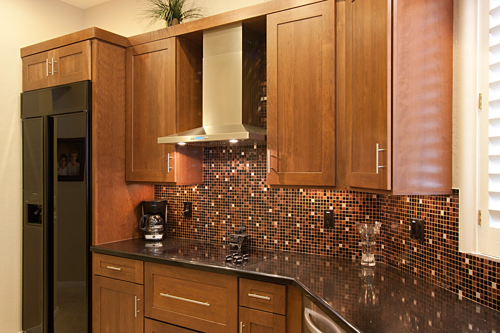 Eat-in kitchen - large transitional ceramic tile eat-in kitchen idea in Phoenix with an undermount sink, flat-panel cabinets, dark wood cabinets, quartz countertops, multicolored backsplash, mosaic tile backsplash, black appliances and no island