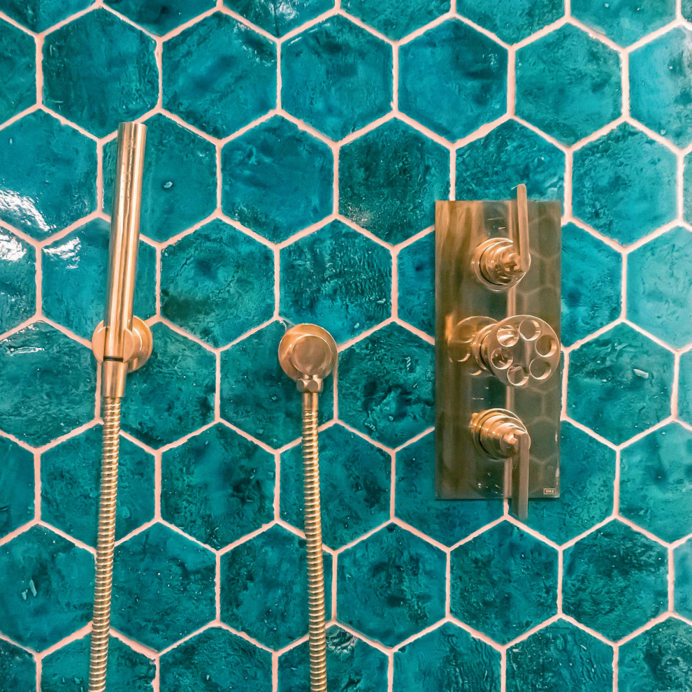 Photo of a mid-sized eclectic 3/4 bathroom in London with a freestanding vanity, turquoise cabinets, an open shower, green tile, terra-cotta tile and an open shower.