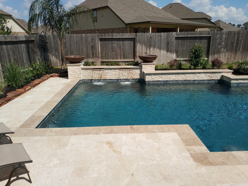 Inspiration for a large transitional backyard stone and rectangular lap hot tub remodel in Houston