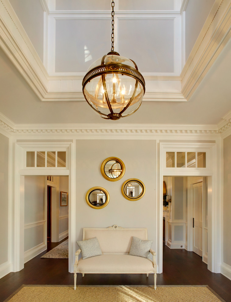 Foyer - traditional dark wood floor foyer idea in New York with gray walls