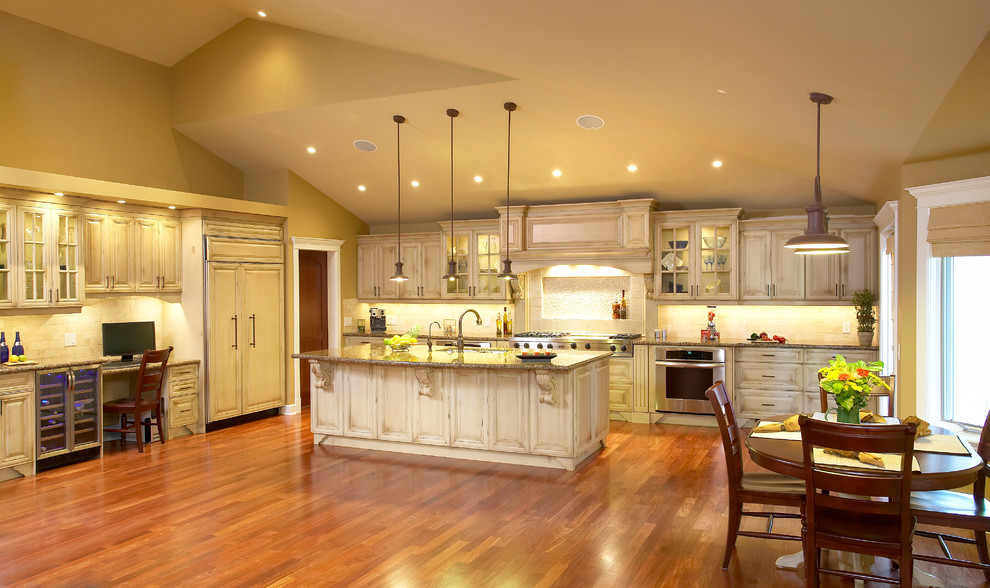 Design ideas for a traditional kitchen in Calgary with raised-panel cabinets and distressed cabinets.