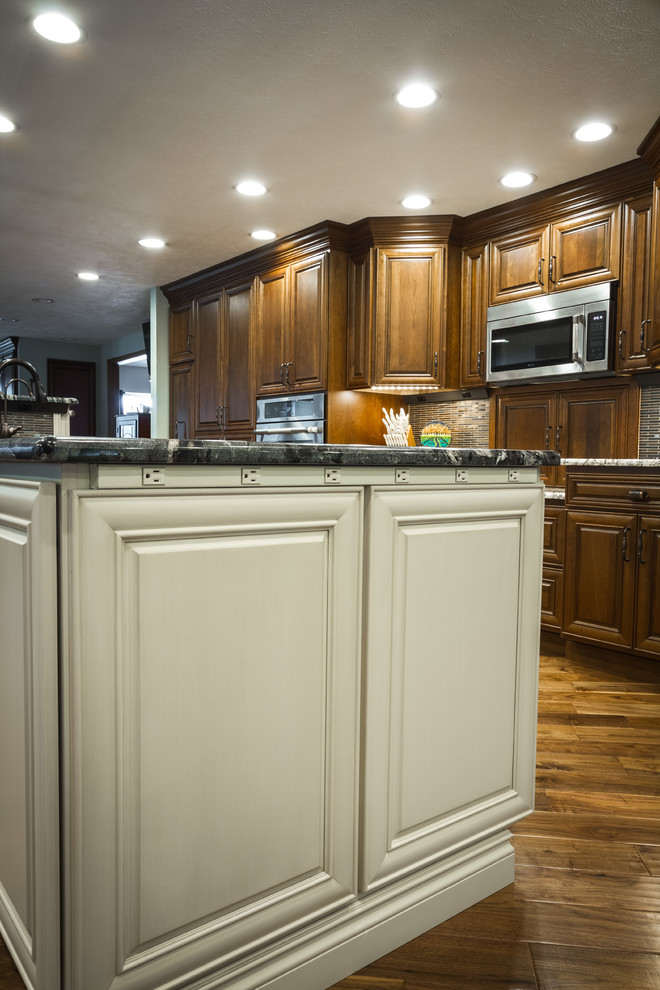 Eat-in kitchen - large transitional l-shaped eat-in kitchen idea with two islands
