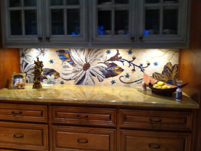 Photo of a contemporary kitchen with multi-coloured splashback and mosaic tile splashback.