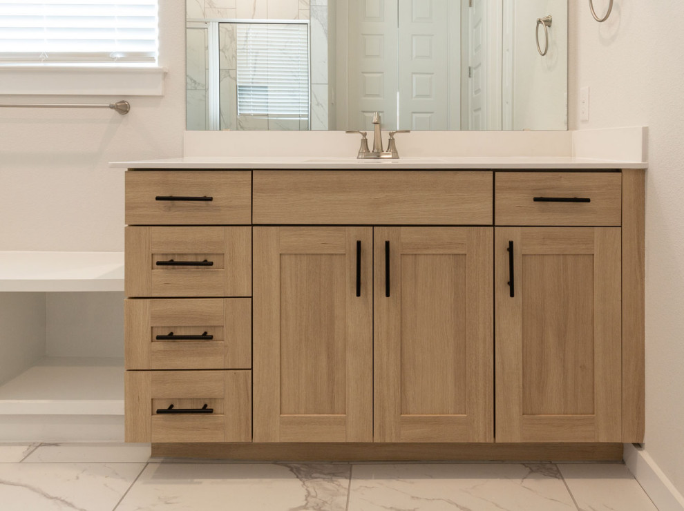 Design ideas for a transitional bathroom in Austin with shaker cabinets, light wood cabinets and a single vanity.