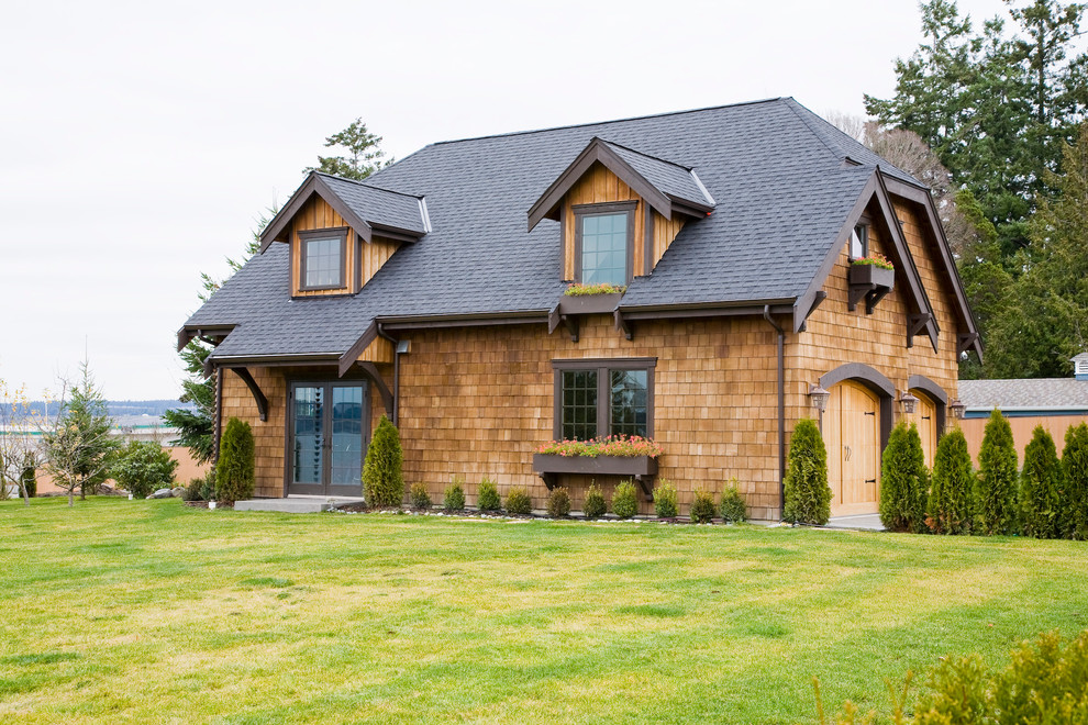 This is an example of a traditional two-storey exterior in Seattle with wood siding.