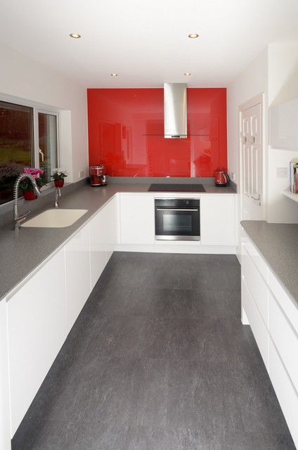 Modern white kitchen with accent red splashback contemporary-kitchen