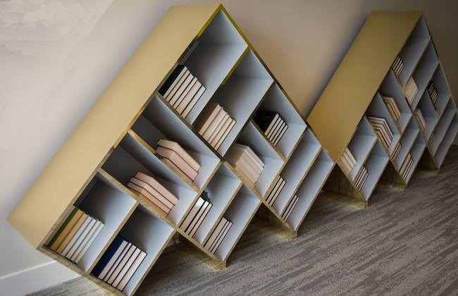 Staircase - mid-sized built-in desk carpeted staircase idea in Houston with beige walls and no fireplace