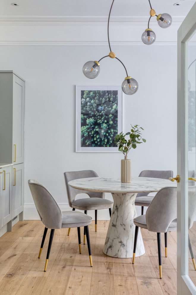 Design ideas for a transitional dining room in London.