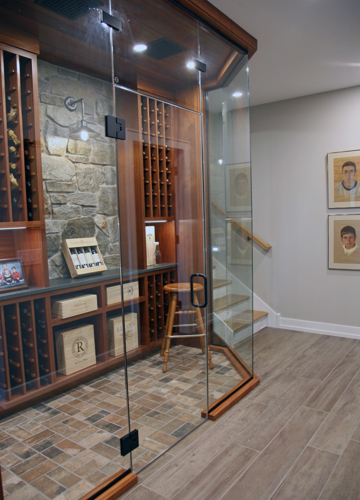 Mid-sized traditional wine cellar in Milwaukee with brick floors, display racks and brown floor.
