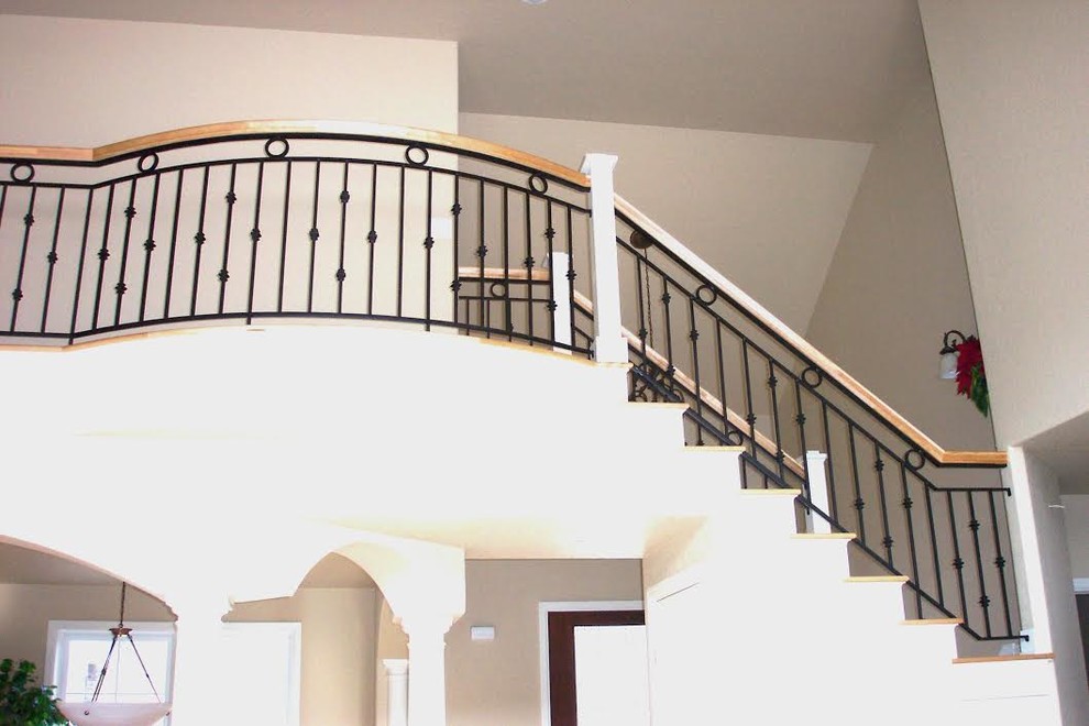 Transitional wooden metal railing staircase photo