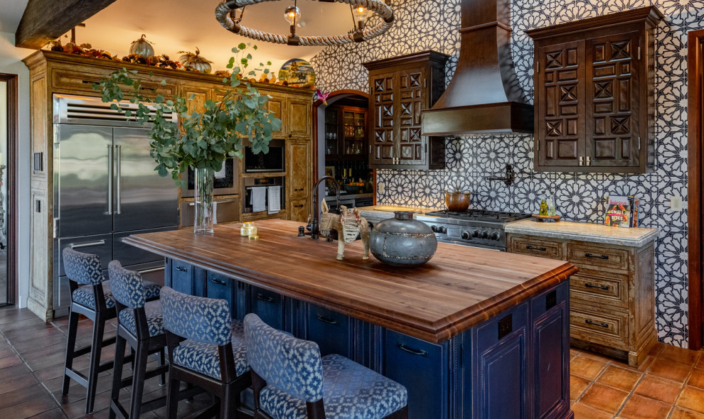 Photo of an eclectic kitchen in Other with with island.