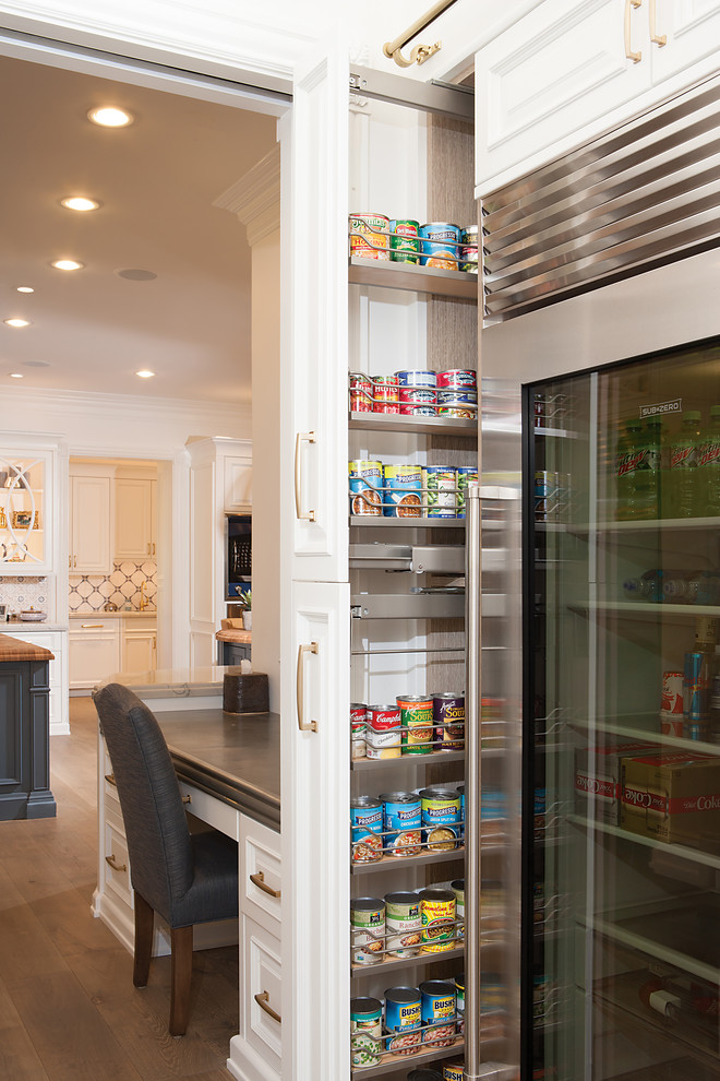 Large traditional l-shaped kitchen pantry in Phoenix with a farmhouse sink, raised-panel cabinets, white cabinets, wood benchtops, multi-coloured splashback, coloured appliances, medium hardwood floors, brown floor and brown benchtop.