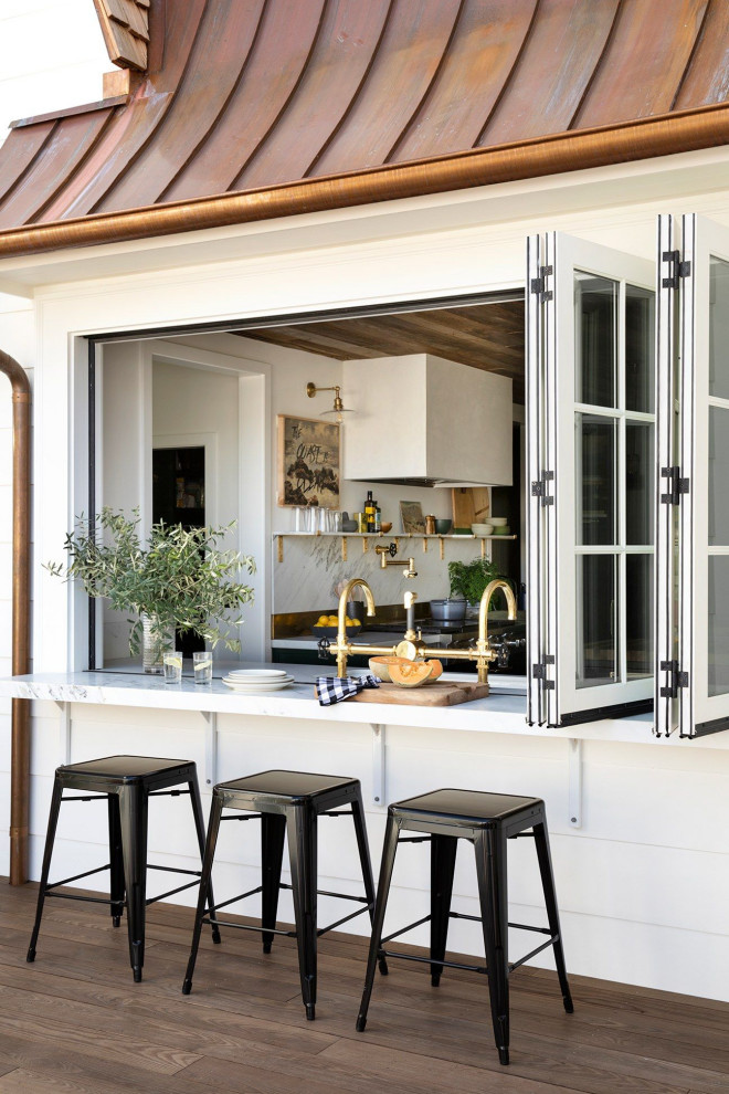 Inspiration for a coastal patio remodel in Seattle with decking and no cover