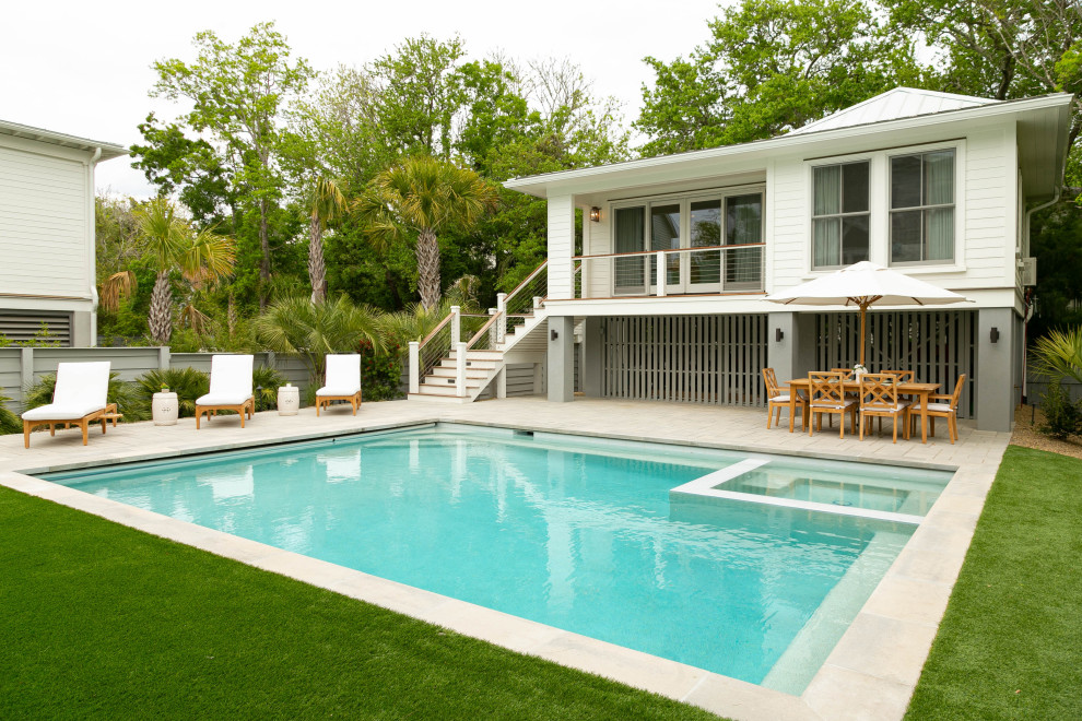 Photo of a coastal back rectangular swimming pool in Charleston with concrete paving.